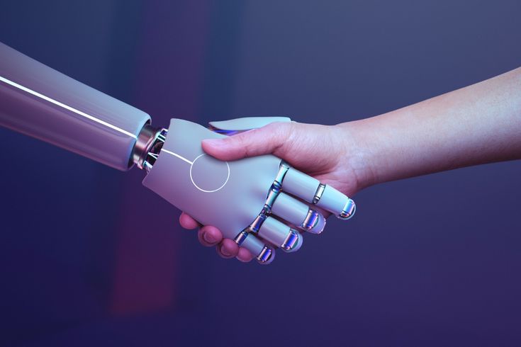 A robotic hand engages in a handshake with a human, representing partnership in the realm of digitixel marketing.